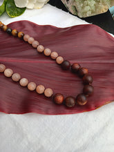 Load image into Gallery viewer, “Hawaiian Island Necklace” - Koa, Peach Moonstone, Tiger Eye, and Lava Stone.