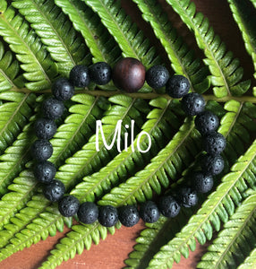 "Spurring with a Hawaiian Wood Bead" - Lava Stone Stone Bracelet with Hawaiian Wood Bead