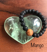 "Spurring with a Hawaiian Wood Bead" - Lava Stone Stone Bracelet with Hawaiian Wood Bead